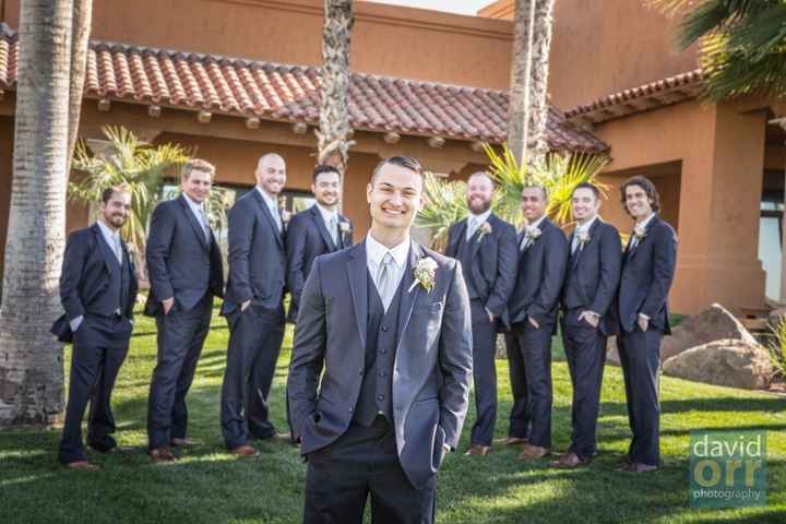 Groom and groomsmen in navy tuxes