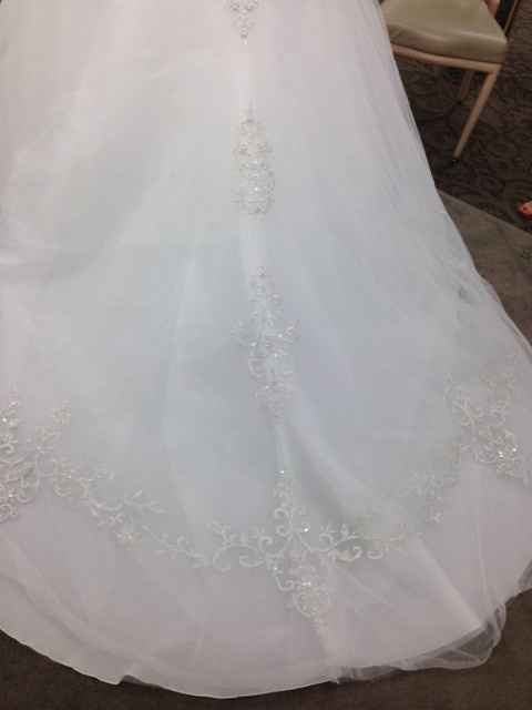 Show me your wedding dresses, and tell me where they are from,and the cost? :)