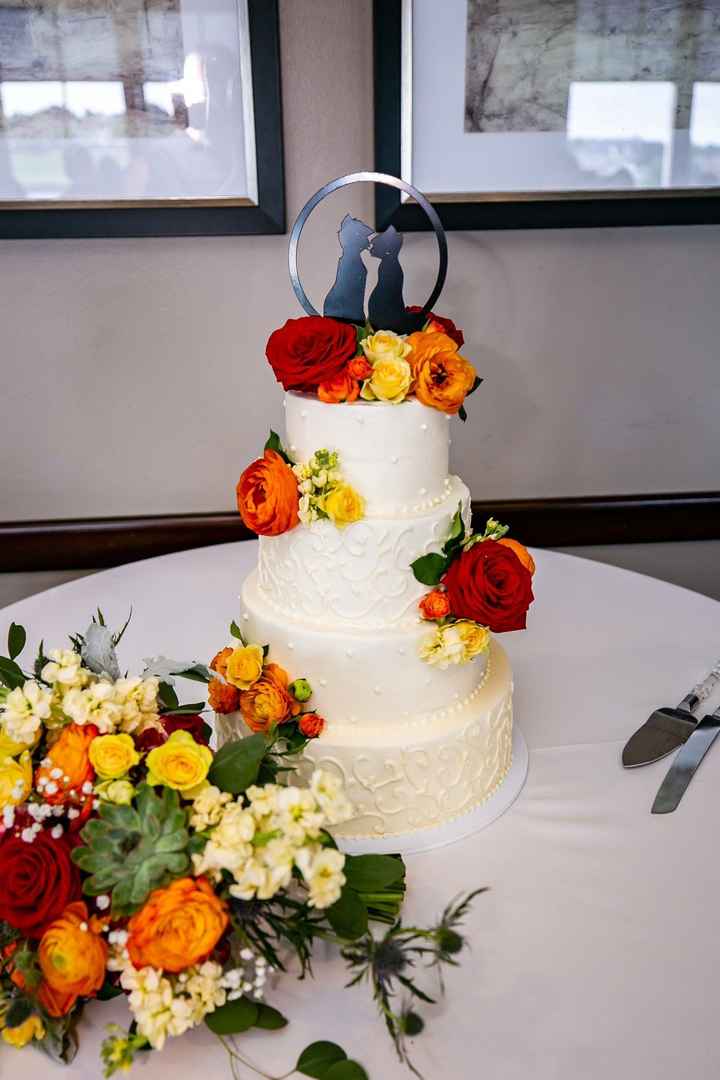 Our cake! With our Aristocats cake topper and my bouquet to add more color to the table.