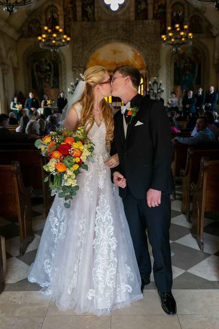 Won't bore you with the whole aisle. But photog made us kiss at the end it so here you go