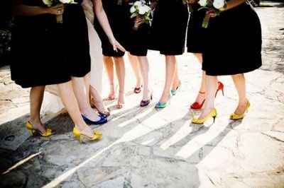 what flowers for black bridesmaids dresses with orange shawls?