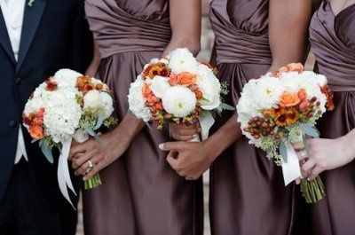 what flowers for black bridesmaids dresses with orange shawls?