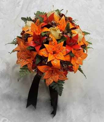what flowers for black bridesmaids dresses with orange shawls?