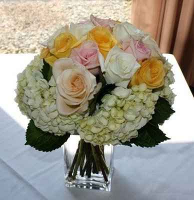 what flowers for black bridesmaids dresses with orange shawls?