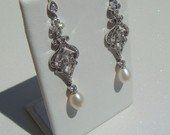 Torn between 2 pairs of earrings; which pair do you think looks best with my dress?