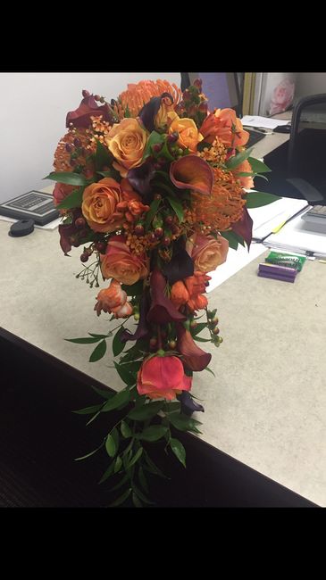 Burgundy, burnt orange and eggplant wedding centerpieces