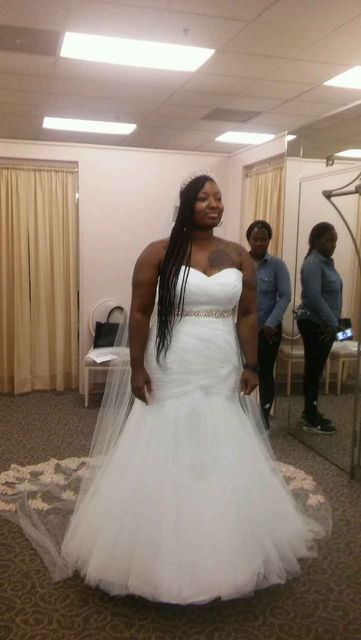 Who is your wedding dress designer? - 1