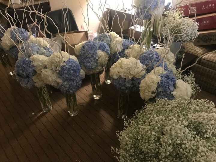 tall centerpieces arranged @ hotel
