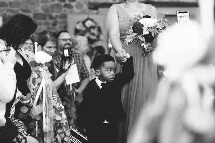 Ring bearer not so sure about all these people 