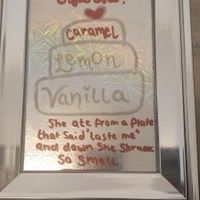 Our cake flavour sign with an alice in wonderland quote