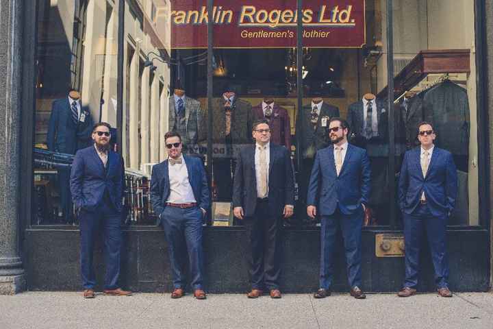 The guys, in front of a store where they did not get their suits, lol