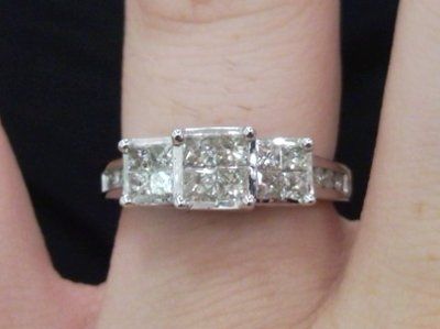 23 small diamonds, and one bigger diamond... I LOVE IT. Lets see some rings my fellow brides.