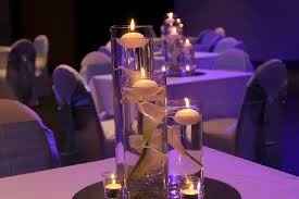 DIY Cylinder tea light holders for wedding centerpieces.