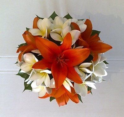 what flowers for black bridesmaids dresses with orange shawls?