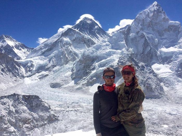 At the summit of Kala Patthar- Mount Everest is the peak to the left of us with cloud around it
