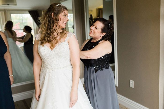 Mom helping me put my dress on