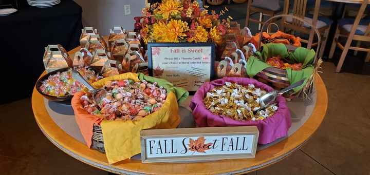 Candy table with little caddies for guests to take treats home