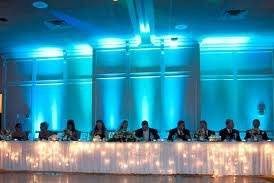 Long table set-up with blue uplighting