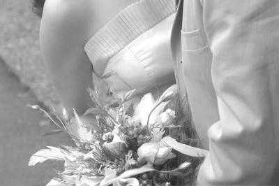 This bride had a particularly lovely neck and Raphaelite look. I felt the sweep of her hair and the angle of the neck as well as the angle at which the picture was taken served to emphasize her beauty and the love she felt for husband.