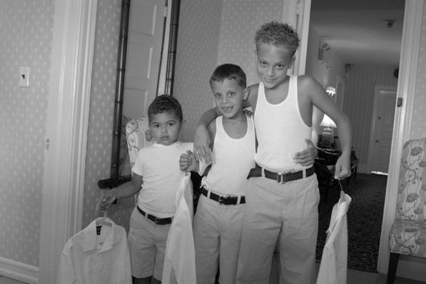 These three junior groomsmen were the most adorable things before they suited up to walk down the aisle. I just loved the wife beater tees aka undershirts while holding their dress shirts.