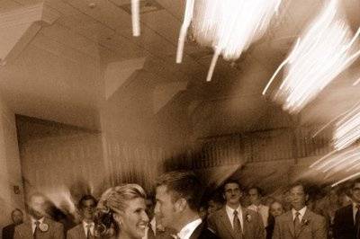 A wedding day is a whirlwind of events but like a top spinning a bride and groom stays fixed and centered in all that is going on around them because it is in the end all about them.