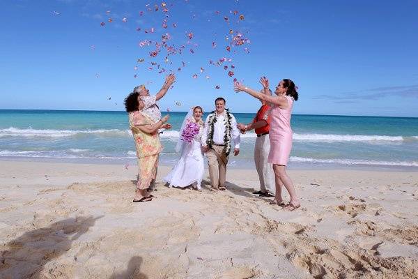 Celebrating with a rose petal shower at Waimanalo Bay