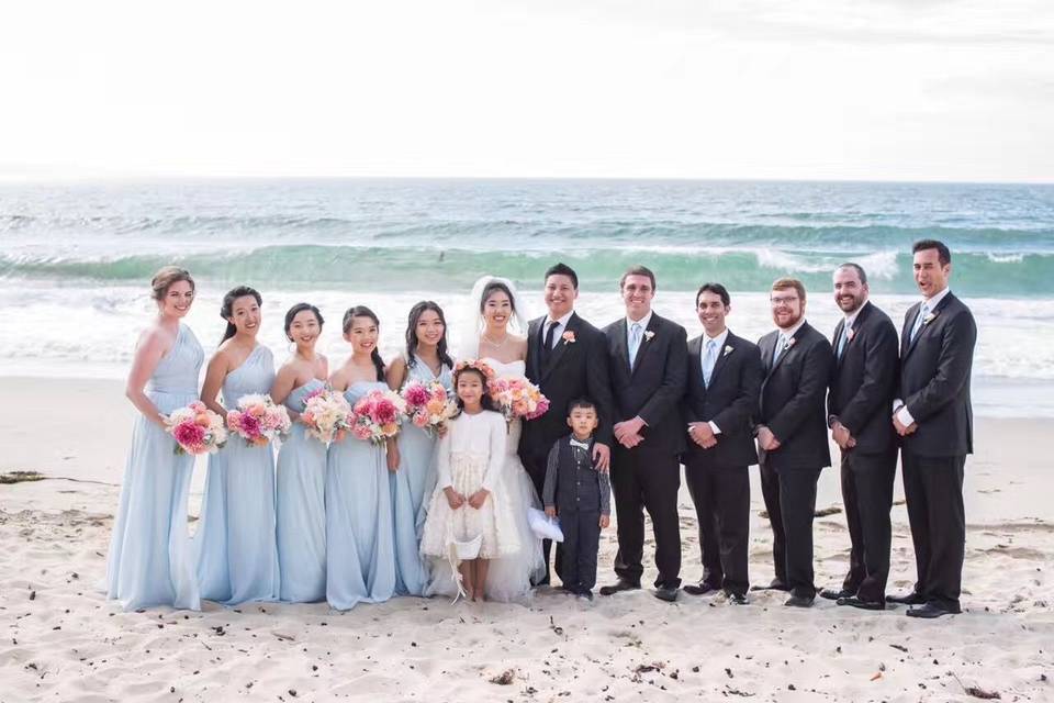 Newlyweds and their guests at the beach