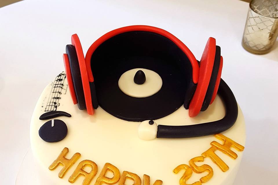 8in Groom's/Birthday DJ Cake to go with the 3 tier wedding cake.  Vanilla and Chocolate marble cake with swiss meringue buttercream, covered in fondant with fondant DJ headphones.