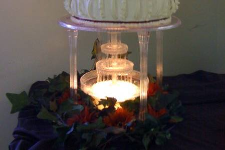 VERY moist strawberry cake (real strawberries in cake) covered with white chocolate dipped strawberries.The greatest compliment the Groom gave me was that he wants me to bake him another one!