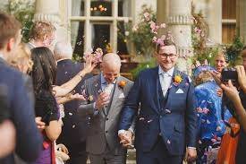 Handsome newlyweds & their rose petal wedding toss!  LGBT wedding celebration!  Flyboy Naturals Rose Petals