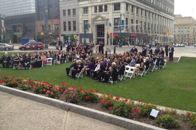 Standing room only.  Guests await the grooms!