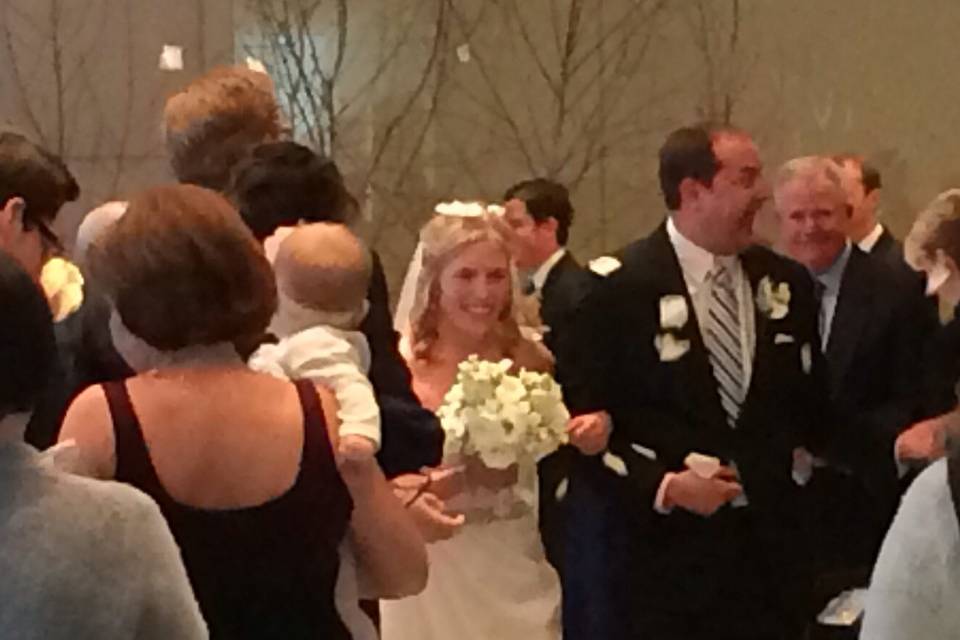 And the happy couple are showered with rose petals.