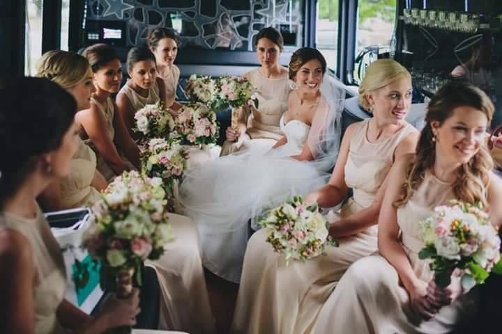 Bride and bridesmaids with their bouquets in hand