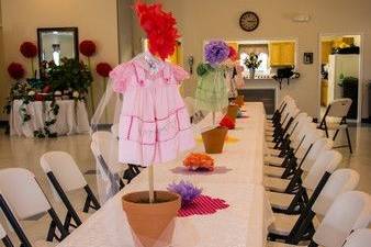 Guest table with potted dresses for a whimsical baby shower