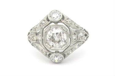 Fabulous Art Deco platinum and diamond engagement ring with an architectural design.