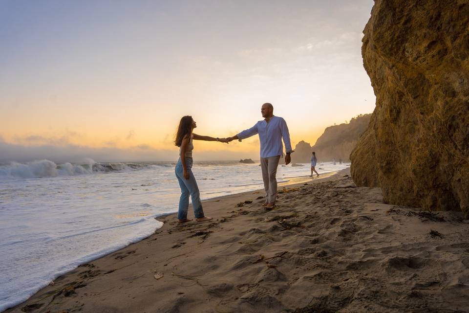 Celebratory couple on beach