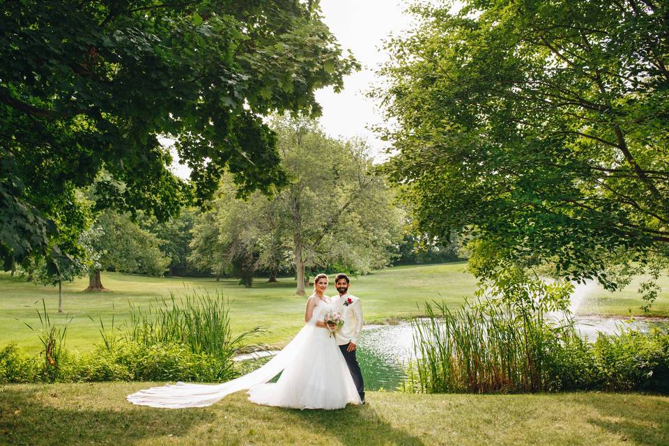 Pond, bride & groom