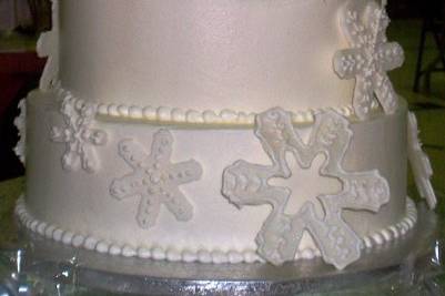 A snow flake themed cake created for a Winter wedding.