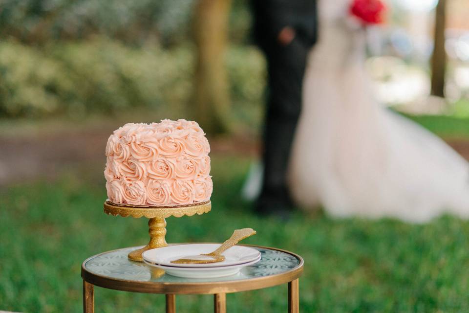 Layered rose frosted gluten free and vegan wedding cake.