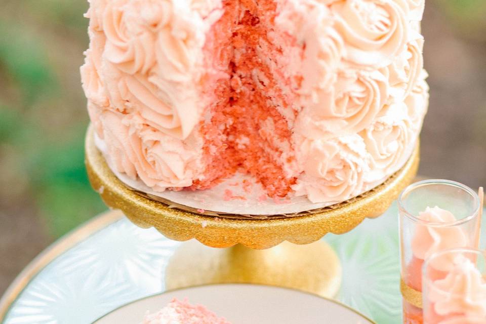 Vegan and gluten free three layer wedding cake covered in rosette frosting.