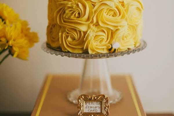 gluten free and vegan vanilla cake with lemon curd filling. Covered in frosting roses.