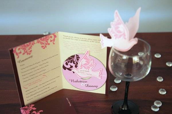 Program with Music CD and Die Cut Dove.Die Cut Dove PlaceCard Holder sits on the glass.