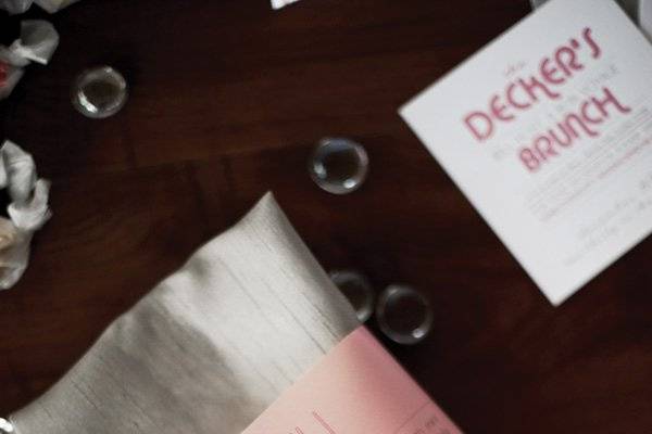 Dusty Rose Vellum Belly Band Menus- wrapped around the silver silk napkin resting on the plate. 2ucollection.com