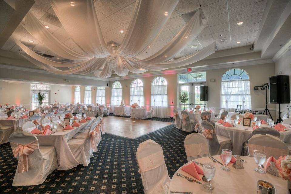 Reception tables with coral decor