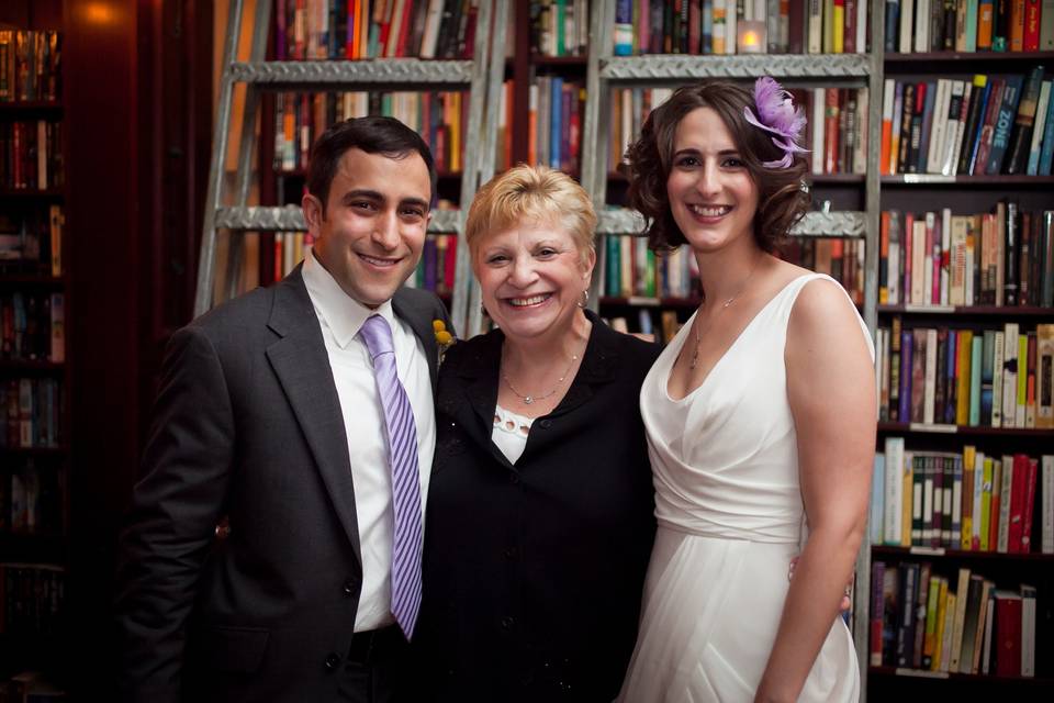 Bride and groom with the officiant