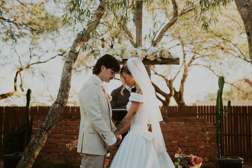 Vows beneath the mesquites.