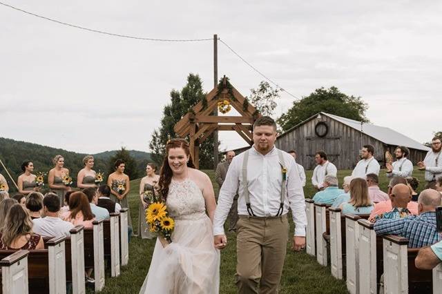 Outdoor wedding with pews