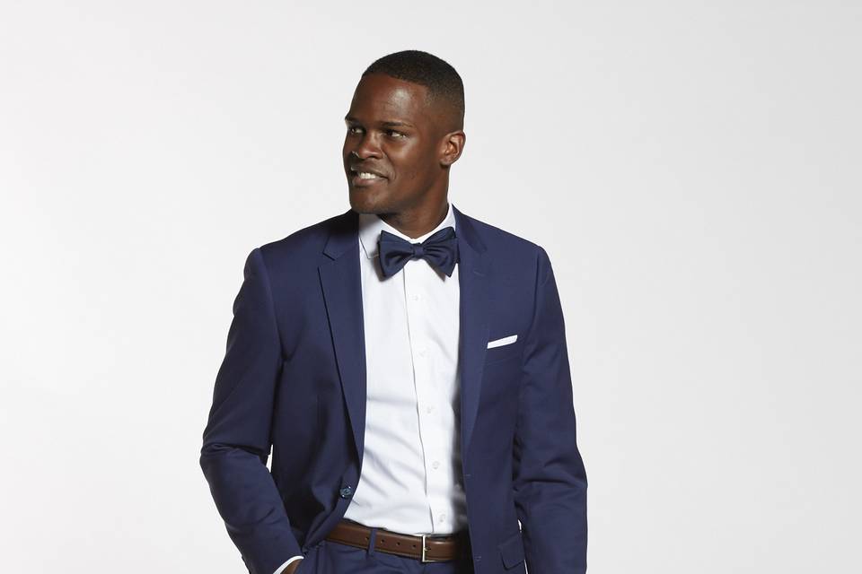 Brilliant blue groomsman suit with bow tie