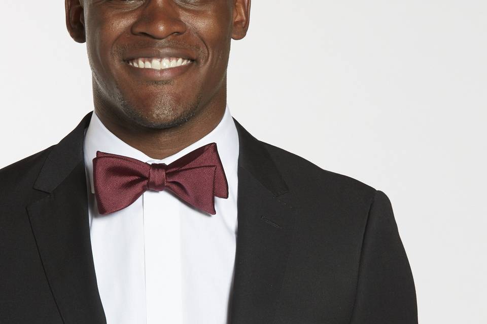 Classic black groomsman suit and red bowtie