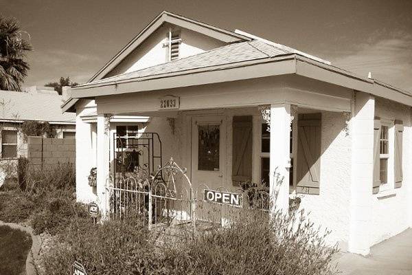 This is The Cottage at Queen Creek.  It was built in 1941.  We bought it in 2005 and remolded and rezoned it to commercial while preserving it's integrity and historical charm.